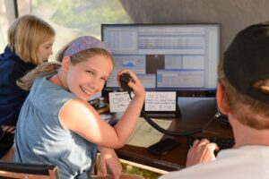 A younger ham operating at Field Day event