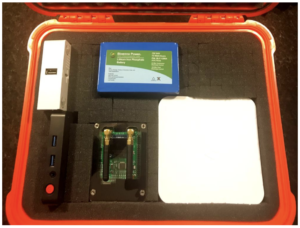 Photo showing a prototype node kit with optional Raspberry Pi DMR hotspot.Battery charger, 12v converters and cables are stowed underneath.