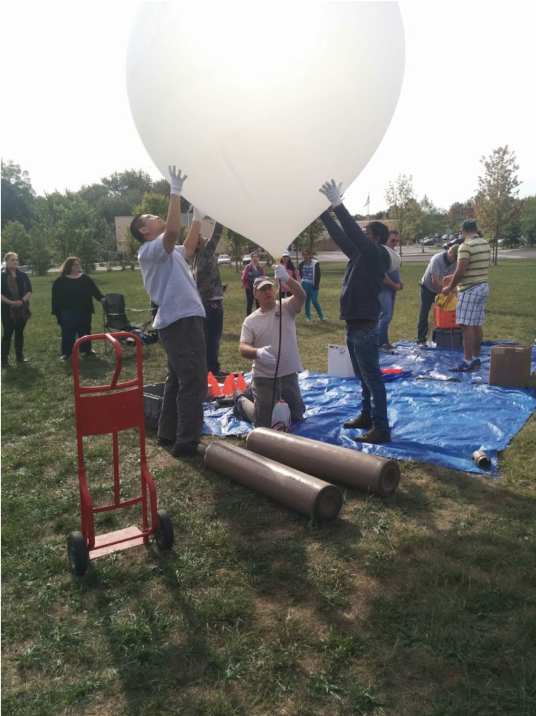 Members of the Westport Astronomical Society’s Amateur Radio Station K1WAS launching a high-altitude balloon from Bridgeport's Discovery Museum